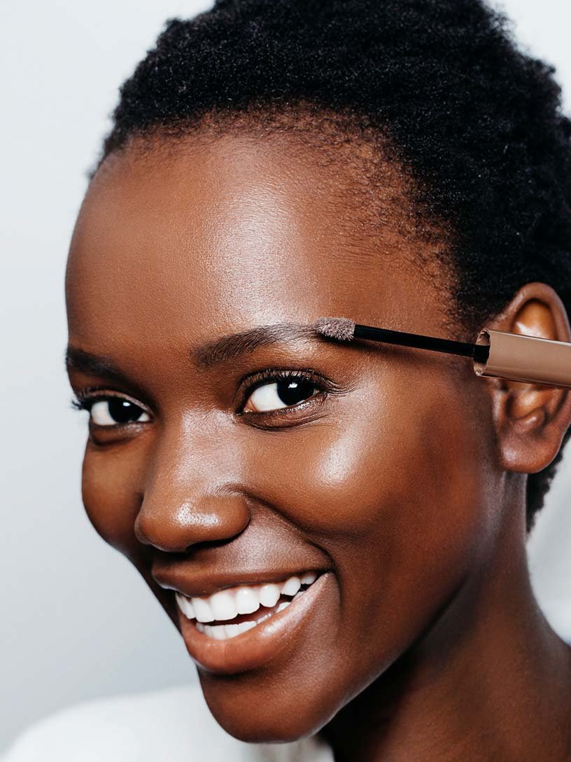 Woman applying Maybelline product on Eyebrow